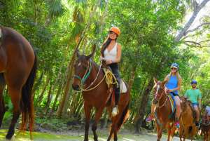 youg girls riding a horse in extreme adventure park in cancun