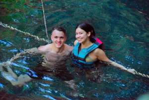 young couple at cenote in cancun extreme adventure tours