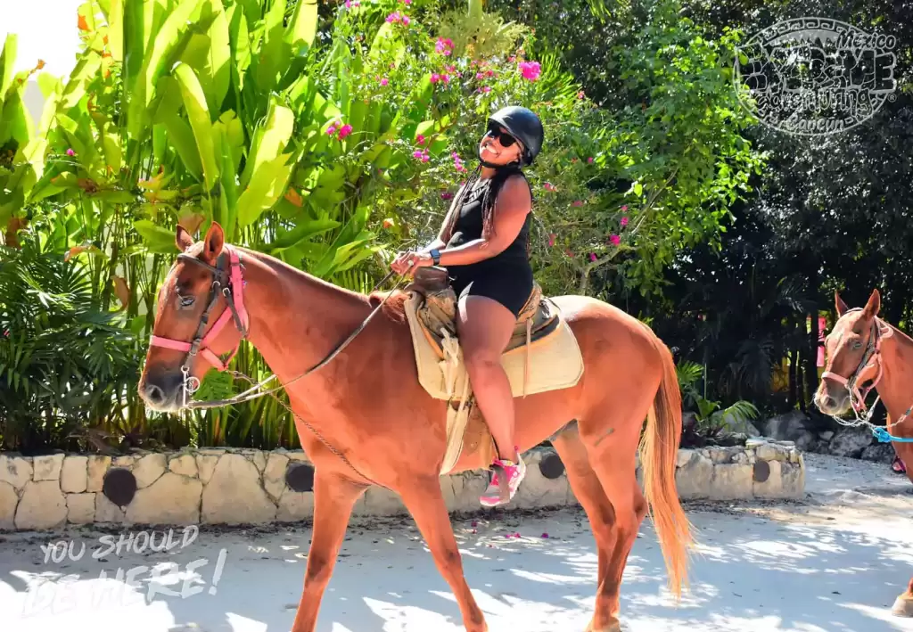 afroamerican-woman-ride-horse-in-cancun-expedition-atv-tours