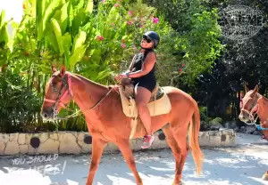 afroamerican-woman-ride-horse-in-cancun-expedition-atv-tours